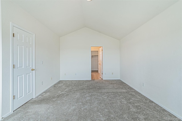 2552 W 82nd Ln Unit C, Westminster, CO 80031 - unfurnished bedroom with light colored carpet, vaulted ceiling, and a spacious closet