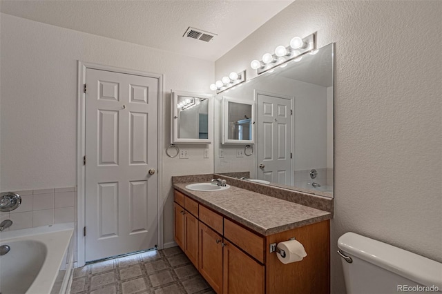 2552 W 82nd Ln Unit C, Westminster, CO 80031 - full bath featuring a bath, vanity, tile patterned floors, and a textured wall