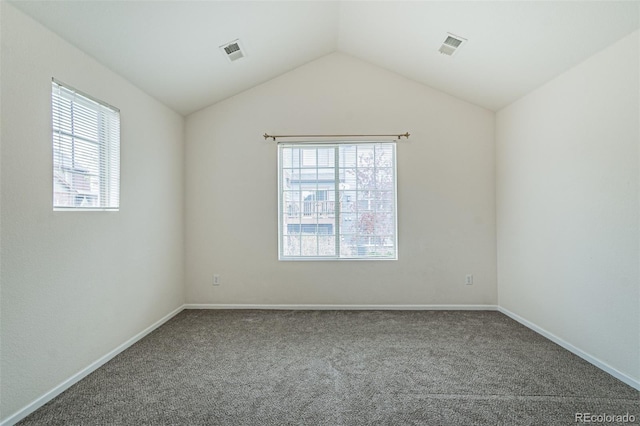 2552 W 82nd Ln Unit C, Westminster, CO 80031 - spare room featuring plenty of natural light, carpet, and vaulted ceiling