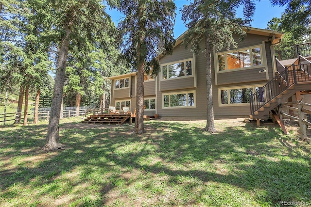7753 Red Fox Dr, Evergreen, CO 80439 - rear view of property featuring stairs and a deck