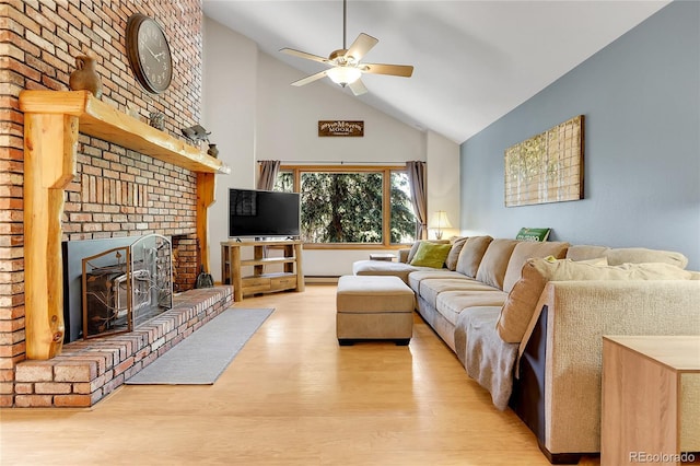 7753 Red Fox Dr, Evergreen, CO 80439 - living room with high vaulted ceiling, a ceiling fan, a fireplace, and light wood-type flooring