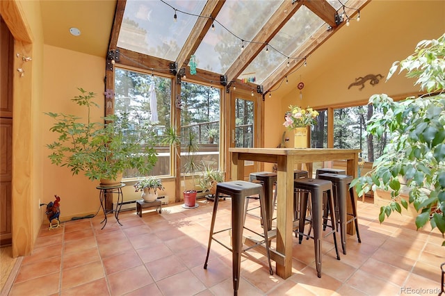 7753 Red Fox Dr, Evergreen, CO 80439 - sunroom / solarium with high vaulted ceiling and tile patterned flooring
