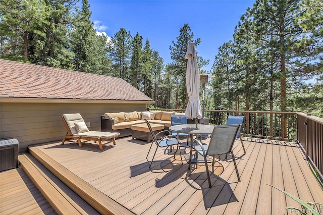 7753 Red Fox Dr, Evergreen, CO 80439 - deck featuring outdoor lounge area, outdoor dining area, and view of scattered trees