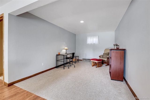 7753 Red Fox Dr, Evergreen, CO 80439 - living area featuring baseboard heating, baseboards, wood finished floors, and recessed lighting
