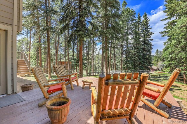 7753 Red Fox Dr, Evergreen, CO 80439 - wooden deck featuring stairway