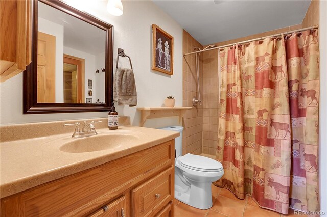 7753 Red Fox Dr, Evergreen, CO 80439 - bathroom with toilet, vanity, tile patterned flooring, and a shower with shower curtain