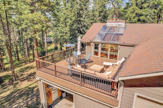 7753 Red Fox Dr, Evergreen, CO 80439 - wooden terrace featuring outdoor dining space