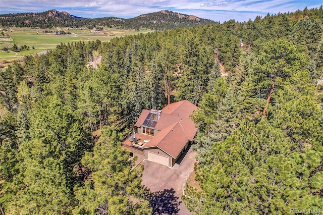 7753 Red Fox Dr, Evergreen, CO 80439 - aerial view of property and surrounding area with a heavily wooded area