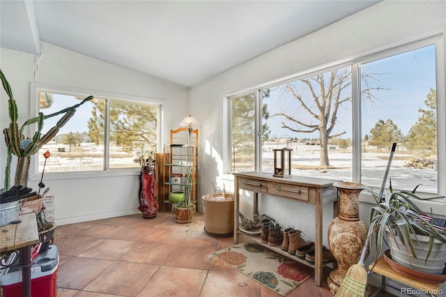 sunroom / solarium with vaulted ceiling