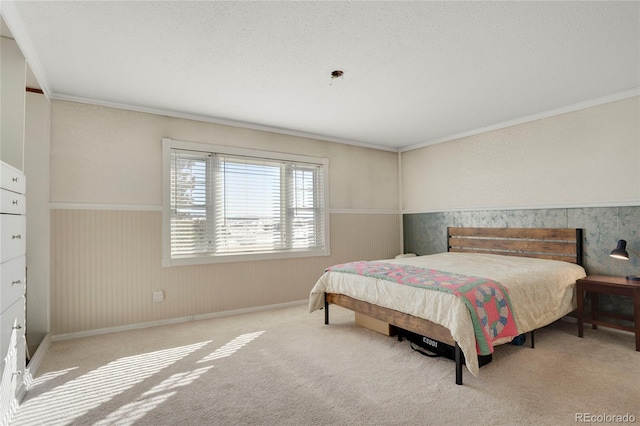 bedroom with crown molding, light colored carpet, and a textured ceiling