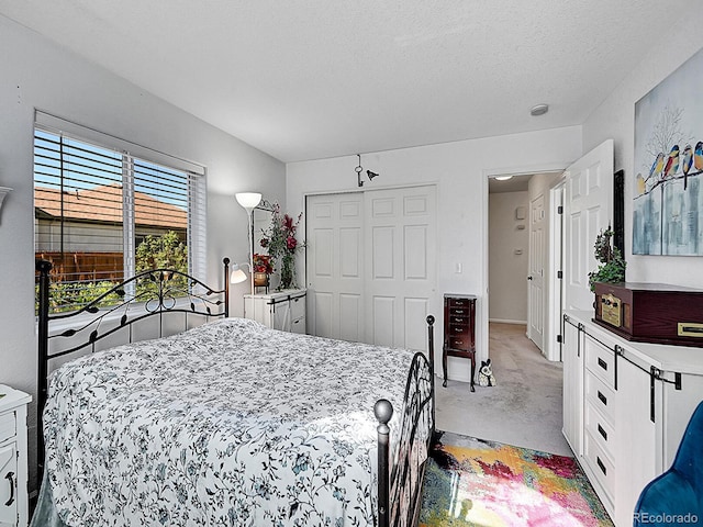 7809 S Flower St, Littleton, CO 80128 - bedroom with a closet and light carpet