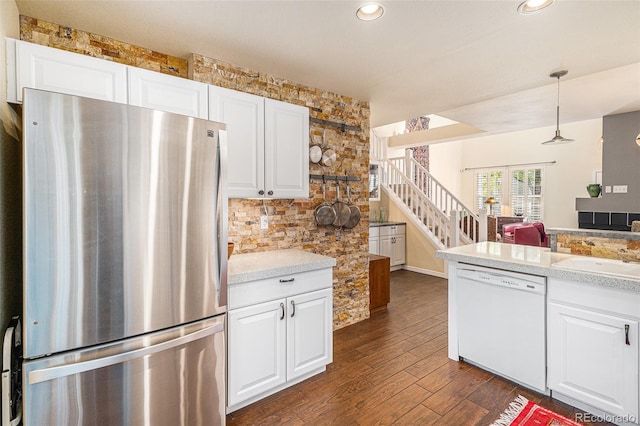 8300 Fairmount Dr Unit M103, Denver, CO 80247 - kitchen featuring freestanding refrigerator, dishwasher, a sink, dark wood-style floors, and light countertops