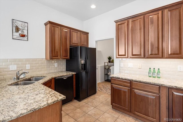 3862 E 127th Ln, Thornton, CO 80241 - kitchen featuring black appliances, backsplash, and light stone counters