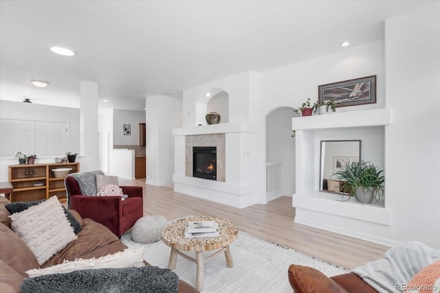 3862 E 127th Ln, Thornton, CO 80241 - living area with a tile fireplace, light wood-style floors, and recessed lighting