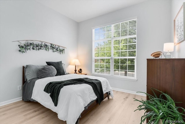 3862 E 127th Ln, Thornton, CO 80241 - bedroom with light wood-type flooring and baseboards