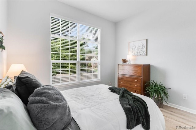 3862 E 127th Ln, Thornton, CO 80241 - bedroom with light wood-type flooring and baseboards