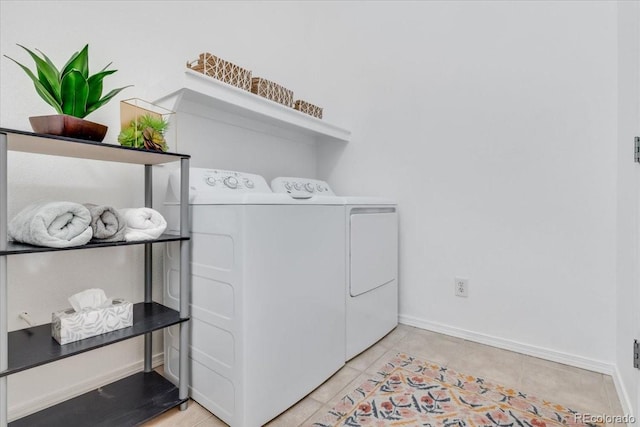 3862 E 127th Ln, Thornton, CO 80241 - laundry room with washer and clothes dryer and light tile patterned floors
