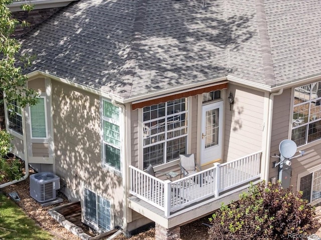 3862 E 127th Ln, Thornton, CO 80241 - rear view of house with a shingled roof and a deck