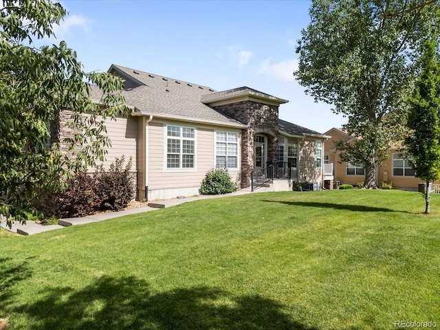 3862 E 127th Ln, Thornton, CO 80241 - rear view of property featuring a yard and roof with shingles