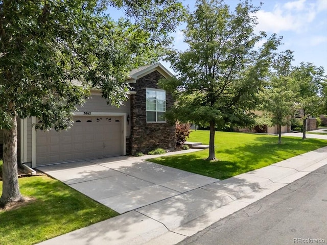 3862 E 127th Ln, Thornton, CO 80241 - view of front of house featuring stone siding, concrete driveway, a front yard, and a garage