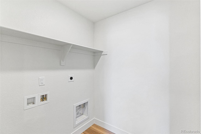 28564 E 6th Pl, Watkins, CO 80137 - laundry area with electric dryer hookup, washer hookup, and light wood finished floors