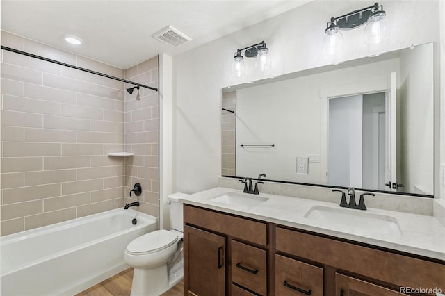 28564 E 6th Pl, Watkins, CO 80137 - full bathroom with double vanity, shower / washtub combination, and wood finished floors