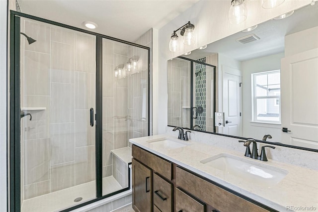 28564 E 6th Pl, Watkins, CO 80137 - bathroom featuring a stall shower and double vanity