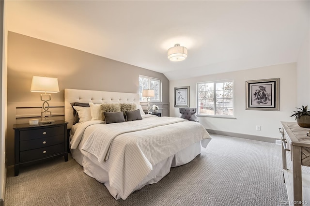 carpeted bedroom with vaulted ceiling