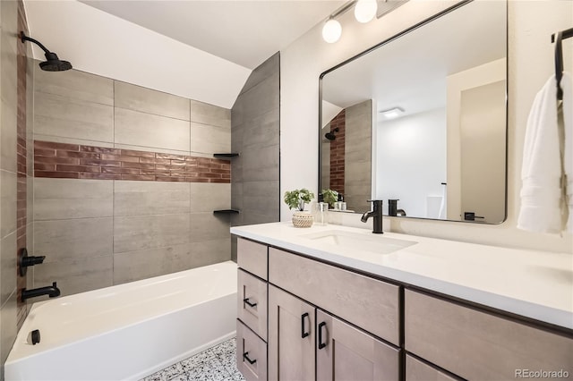 bathroom featuring vanity and tiled shower / bath combo