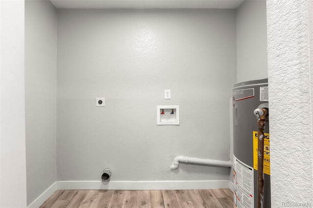 clothes washing area featuring laundry area, hookup for an electric dryer, light wood-style floors, water heater, and washer hookup