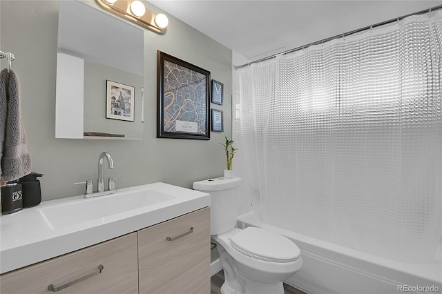 bathroom featuring shower / bathtub combination with curtain, vanity, and toilet