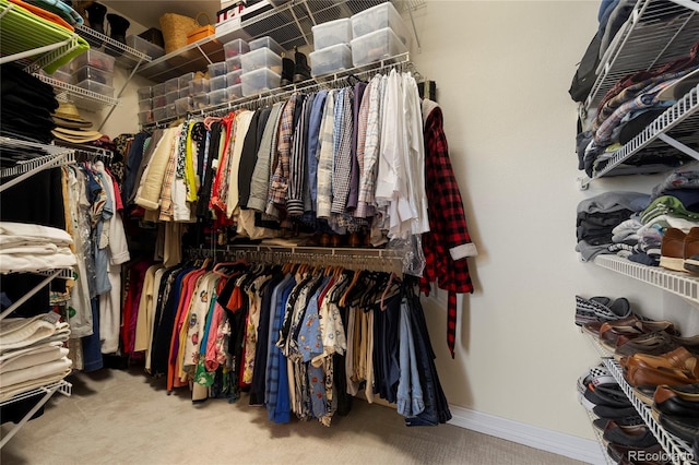 spacious closet with carpet flooring