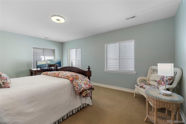 carpeted bedroom with baseboards