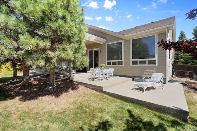 rear view of house with a patio