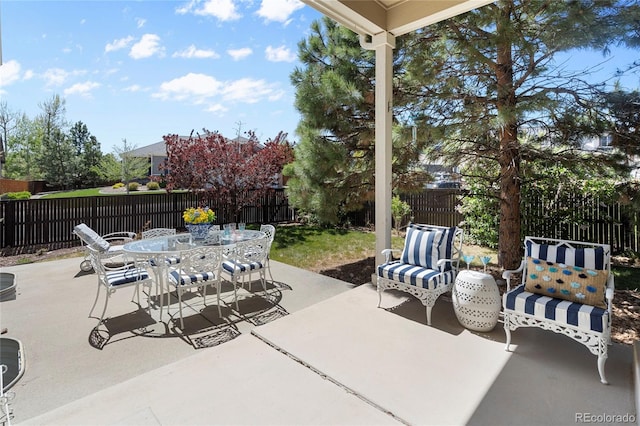view of patio / terrace with a fenced backyard and outdoor dining area