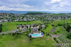 view of property location featuring a pool