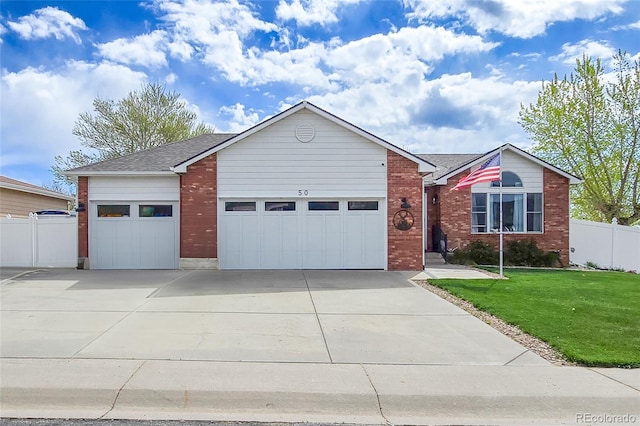 50 S Dickson St, Keenesburg, CO 80643 - ranch-style home featuring a garage, concrete driveway, brick siding, and a shingled roof