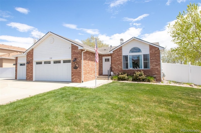 50 S Dickson St, Keenesburg, CO 80643 - ranch-style home featuring an attached garage, driveway, and brick siding