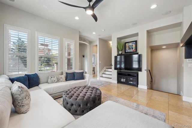 living room with tile patterned flooring, recessed lighting, baseboards, and ceiling fan