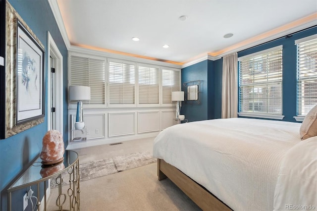 carpeted bedroom featuring crown molding, recessed lighting, and visible vents