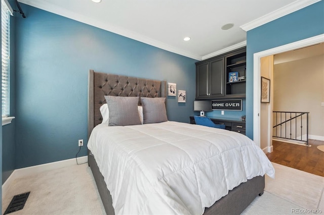 bedroom featuring visible vents, crown molding, wood finished floors, baseboards, and recessed lighting