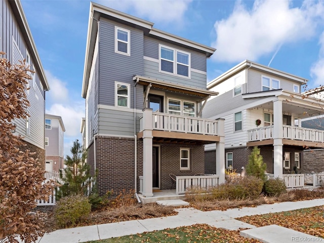 view of front of house with a balcony