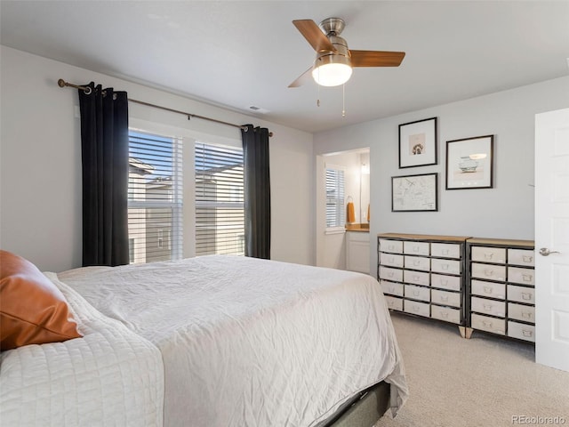 bedroom with light carpet and ceiling fan