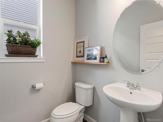 bathroom with toilet and sink