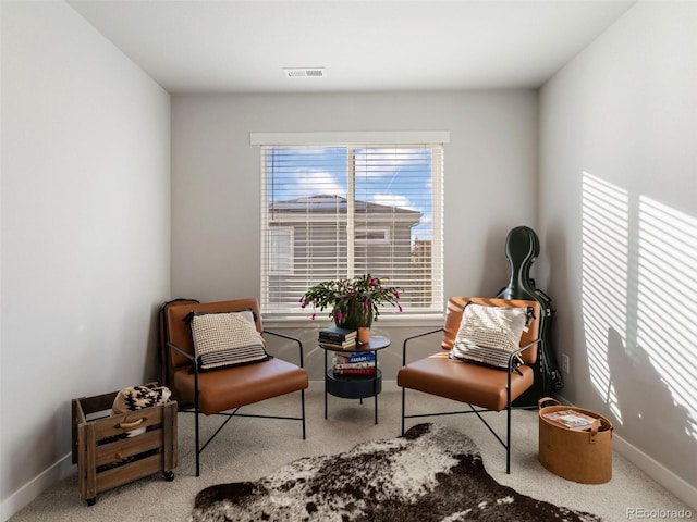 sitting room with light carpet