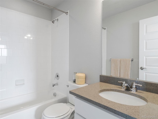 full bathroom with vanity, toilet, and tiled shower / bath