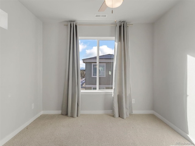 carpeted empty room with ceiling fan