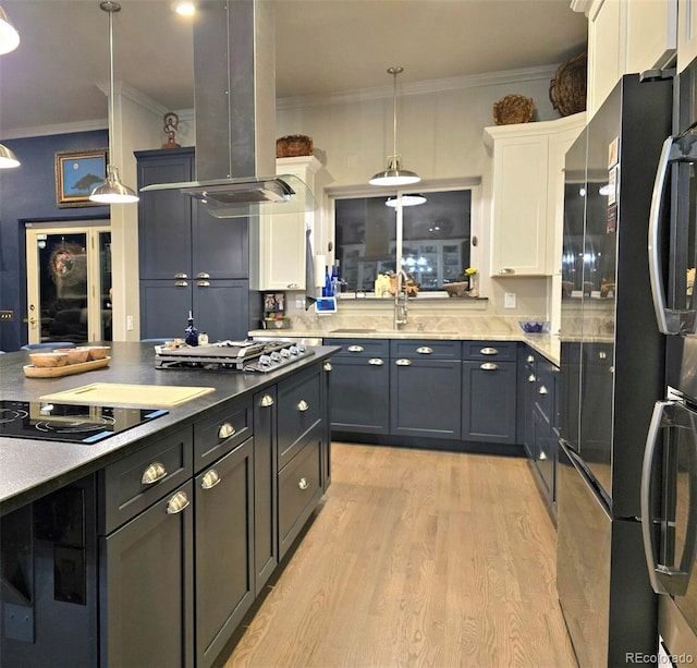 83 Wilderness Cornerstone Rd, Evergreen, CO 80439 - kitchen with black appliances, ornamental molding, island exhaust hood, white cabinets, and light wood-type flooring