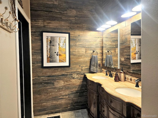 83 Wilderness Cornerstone Rd, Evergreen, CO 80439 - bathroom featuring wood walls and double vanity