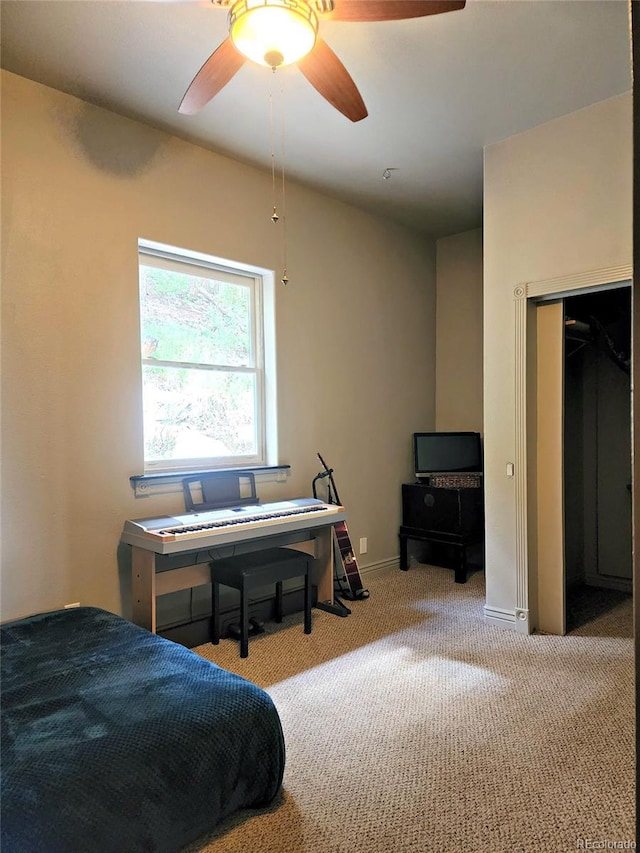 83 Wilderness Cornerstone Rd, Evergreen, CO 80439 - carpeted bedroom with baseboards and a ceiling fan